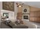 Spacious living room with a stone fireplace and built-in cabinets at 8006 Oak Dr, Palmetto, FL 34221