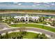 Community clubhouse and pool area with surrounding landscaping at 8684 Canyon Creek Trl, Parrish, FL 34219