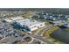 Aerial view of community with Publix and lake at 8684 Canyon Creek Trl, Parrish, FL 34219