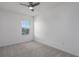 Bright bedroom with window and carpeted floor at 8684 Canyon Creek Trl, Parrish, FL 34219
