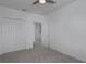Bedroom with double door closet and access to another bedroom at 8684 Canyon Creek Trl, Parrish, FL 34219