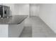 Modern kitchen with stainless steel appliances, an island, and white cabinets at 8684 Canyon Creek Trl, Parrish, FL 34219