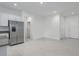 Modern kitchen with stainless steel appliances, an island, and white cabinets at 8684 Canyon Creek Trl, Parrish, FL 34219