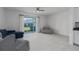 Living room with gray sofas and sliding glass doors leading to a patio at 8684 Canyon Creek Trl, Parrish, FL 34219