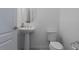 Clean powder room with pedestal sink and toilet at 8684 Canyon Creek Trl, Parrish, FL 34219