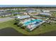 Community resort-style pool with cabanas and landscaping at 8684 Canyon Creek Trl, Parrish, FL 34219