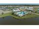 Community resort-style pool with cabanas and landscaping at 8684 Canyon Creek Trl, Parrish, FL 34219