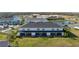 Aerial view of townhomes, playground and pond at 8684 Canyon Creek Trl, Parrish, FL 34219
