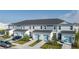 Exterior view of townhomes with blue garages at 8684 Canyon Creek Trl, Parrish, FL 34219