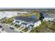 Aerial view of townhomes near a pond at 8684 Canyon Creek Trl, Parrish, FL 34219