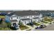 Aerial view of townhomes, landscaping and driveway at 8684 Canyon Creek Trl, Parrish, FL 34219