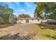 Large backyard with a view of the house at 9066 Oneal Ave, New Port Richey, FL 34654