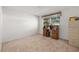 Spacious bedroom with carpeted floors and a built-in desk at 9066 Oneal Ave, New Port Richey, FL 34654