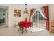 Dining area with a round table, chairs and sliding glass doors at 9066 Oneal Ave, New Port Richey, FL 34654