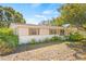 Ranch-style home with a light-colored exterior, landscaping, and a spacious yard at 9066 Oneal Ave, New Port Richey, FL 34654