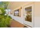 Front door entrance with glass panels and side windows at 9066 Oneal Ave, New Port Richey, FL 34654