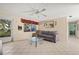 Living room with tiled floors, sofa, and coffee table at 9066 Oneal Ave, New Port Richey, FL 34654