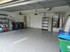 Attached garage with washer, dryer, and storage at 9400 Ridge Rd, Seminole, FL 33772