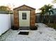 Wooden storage shed in backyard at 9400 Ridge Rd, Seminole, FL 33772