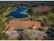 Aerial view of clubhouse near golf course and lake at 9481 Highland Oak Dr # 1403, Tampa, FL 33647