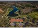 Aerial view of clubhouse near golf course and lake at 9481 Highland Oak Dr # 1403, Tampa, FL 33647