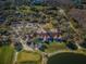 Aerial view of clubhouse, golf course, and lake at 9481 Highland Oak Dr # 1403, Tampa, FL 33647