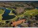 Aerial view of clubhouse, golf course, and lake at 9481 Highland Oak Dr # 1403, Tampa, FL 33647