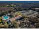 Aerial view of tennis courts, pool, and clubhouse at 9481 Highland Oak Dr # 1403, Tampa, FL 33647