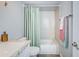 Simple bathroom with a tub/shower combo and white vanity at 9481 Highland Oak Dr # 1403, Tampa, FL 33647