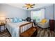 Guest bedroom with queen bed, chair, and built-in bench at 9481 Highland Oak Dr # 1403, Tampa, FL 33647