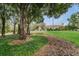 Community clubhouse with landscaping and tree-lined lawn at 9481 Highland Oak Dr # 1403, Tampa, FL 33647