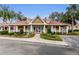 Community clubhouse with welcoming porch and landscaping at 9481 Highland Oak Dr # 1403, Tampa, FL 33647