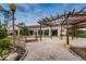 Relaxing community patio with pergola and brick pavers at 9481 Highland Oak Dr # 1403, Tampa, FL 33647