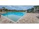 Community lap pool and leisure pool with waterslide at 9481 Highland Oak Dr # 1403, Tampa, FL 33647