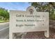 Bright Horizons Golf & Country Club community sign with directions to Tennis & Athletic Center at 9481 Highland Oak Dr # 1403, Tampa, FL 33647