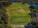 Aerial view of a driving range with multiple tee boxes at 9481 Highland Oak Dr # 1403, Tampa, FL 33647