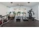 Well-equipped fitness center with treadmills, stationary bike, and weight machine at 9481 Highland Oak Dr # 1403, Tampa, FL 33647