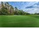 Golf course putting green with sand trap at 9481 Highland Oak Dr # 1403, Tampa, FL 33647