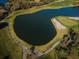 Aerial view of a lake next to a golf course at 9481 Highland Oak Dr # 1403, Tampa, FL 33647