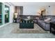 Spacious living area with sectional sofa, coffee table, and access to patio at 9481 Highland Oak Dr # 1403, Tampa, FL 33647