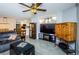 Living Room with gray couch and large TV at 9481 Highland Oak Dr # 1403, Tampa, FL 33647