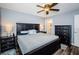 Main bedroom with king-size bed, ceiling fan, and double dresser at 9481 Highland Oak Dr # 1403, Tampa, FL 33647