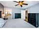 Main bedroom with king bed, 2 dressers, and access to bathroom at 9481 Highland Oak Dr # 1403, Tampa, FL 33647