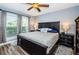 King-size bed, ceiling fan, and ample closet space in main bedroom at 9481 Highland Oak Dr # 1403, Tampa, FL 33647
