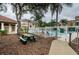 Community picnic area with tables and pool view at 9481 Highland Oak Dr # 1403, Tampa, FL 33647