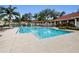 Resort-style community pool with multiple seating areas at 9481 Highland Oak Dr # 1403, Tampa, FL 33647