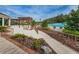 Landscaped pool area with pergola and seating at 9481 Highland Oak Dr # 1403, Tampa, FL 33647