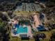 Aerial view of a community pool and tennis courts at 9481 Highland Oak Dr # 1403, Tampa, FL 33647