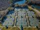 Aerial view of a community with numerous tennis courts at 9481 Highland Oak Dr # 1403, Tampa, FL 33647
