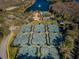 Aerial view of numerous well-maintained tennis courts in a community setting at 9481 Highland Oak Dr # 1403, Tampa, FL 33647
